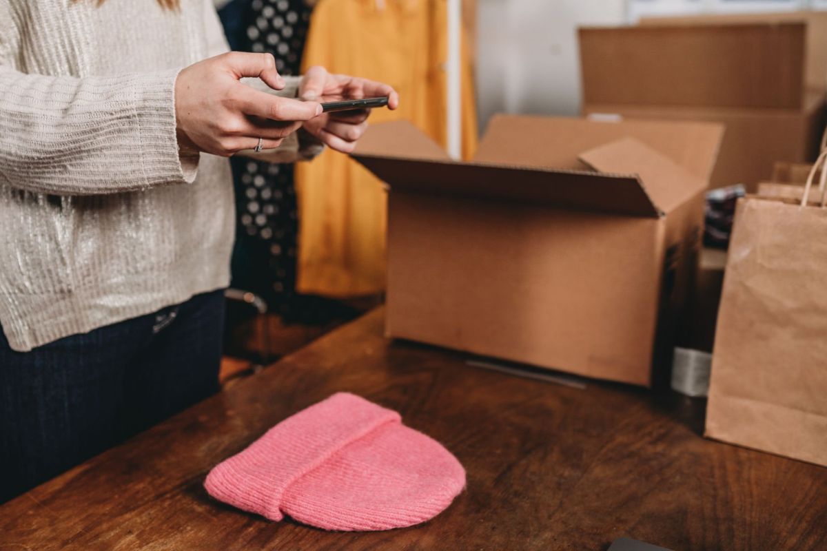 A lady selling winter hats online