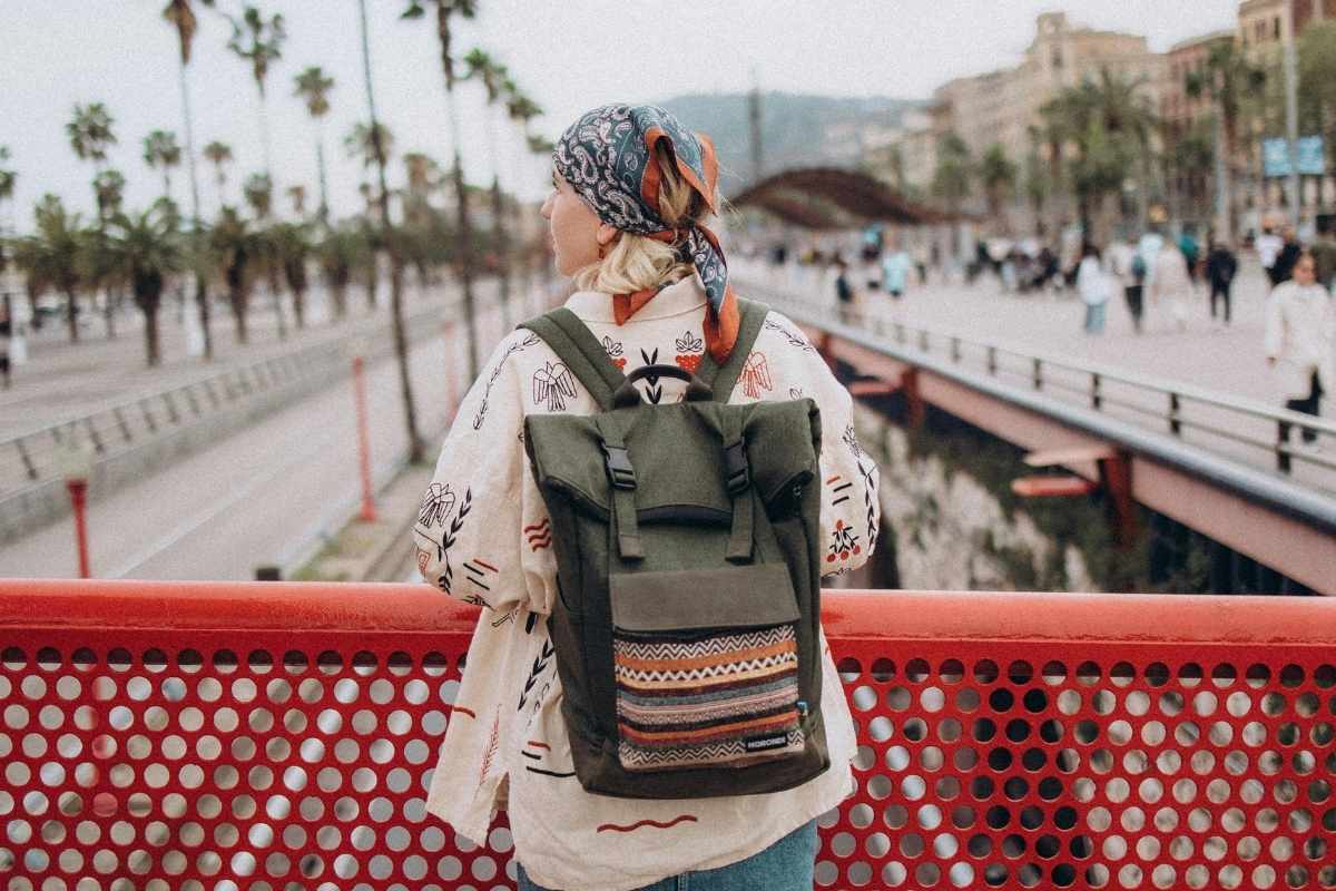 A lady wearing embroidered hiking backpack