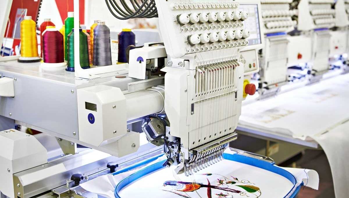 A machine embroidering a bandana