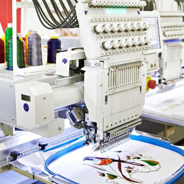 A machine embroidering a bandana