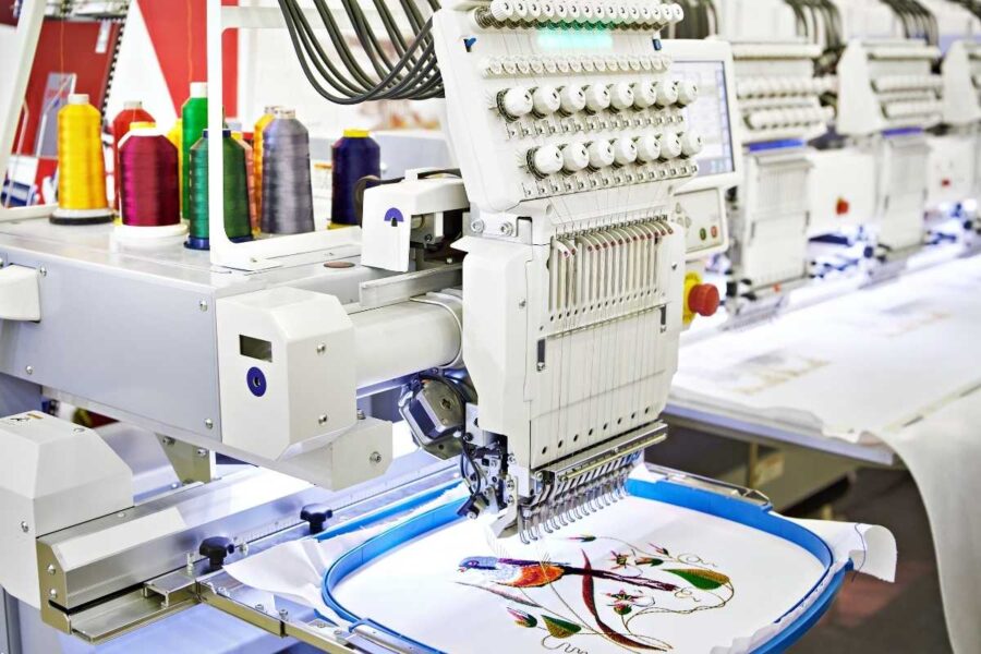 A machine embroidering a bandana