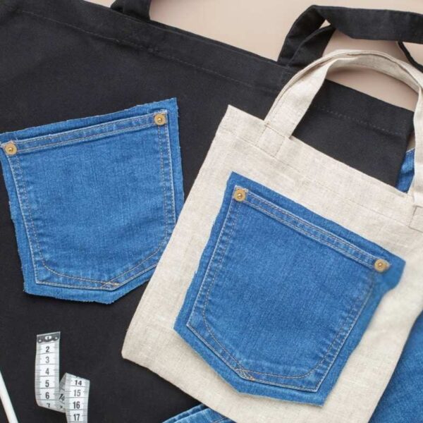 A person is customizing a tote bag