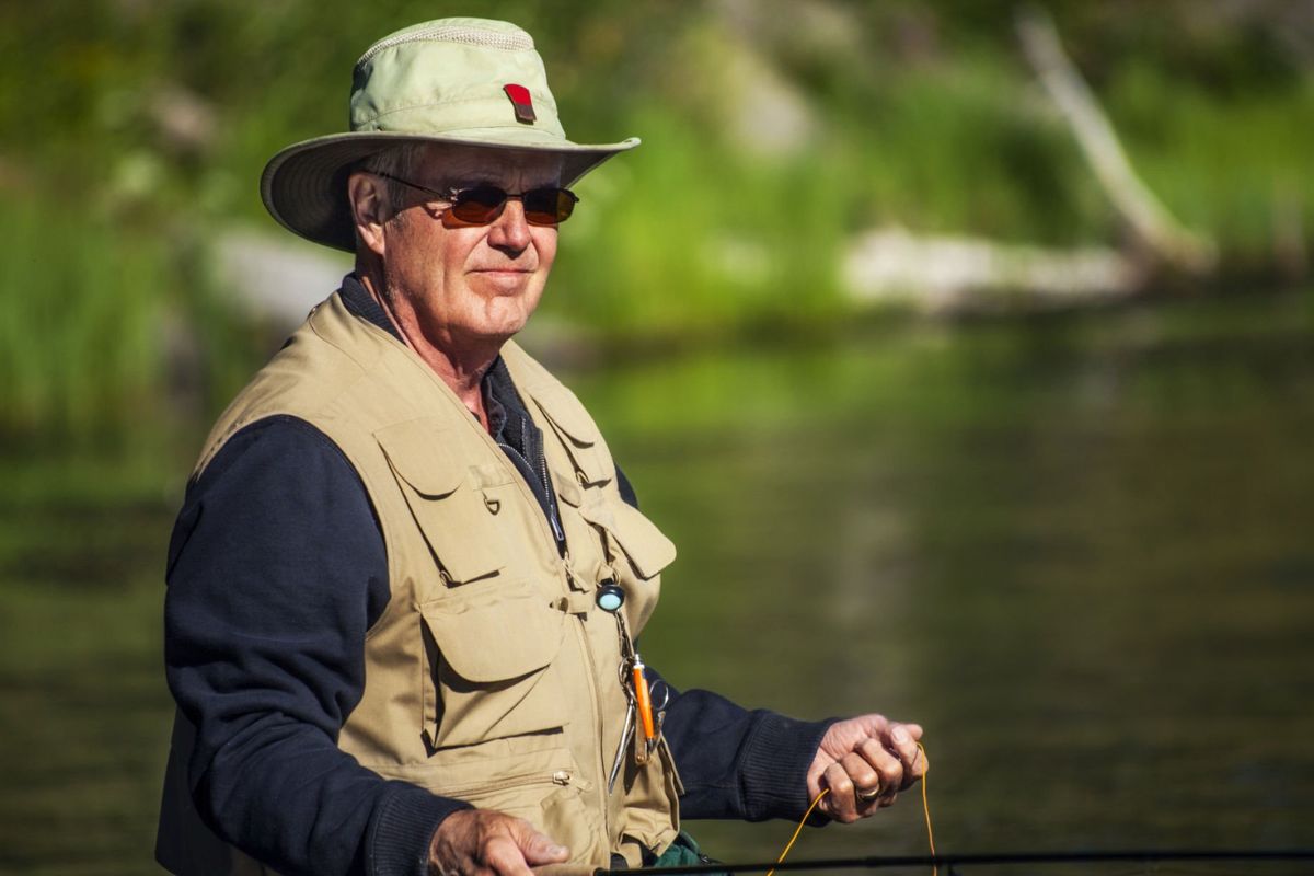 A person wearing custom fishing hat