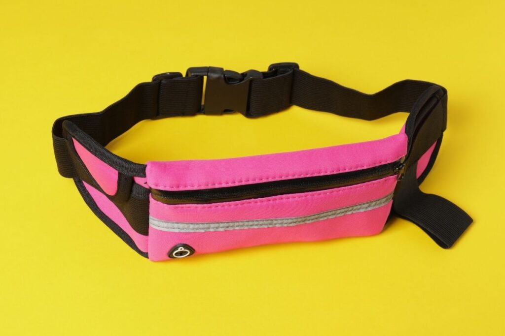 A pink-colored waist bag shown in the image