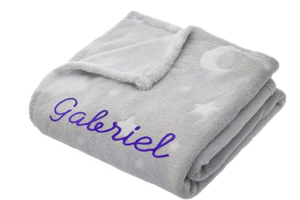 A soft embroidered baby blanket shown in the image