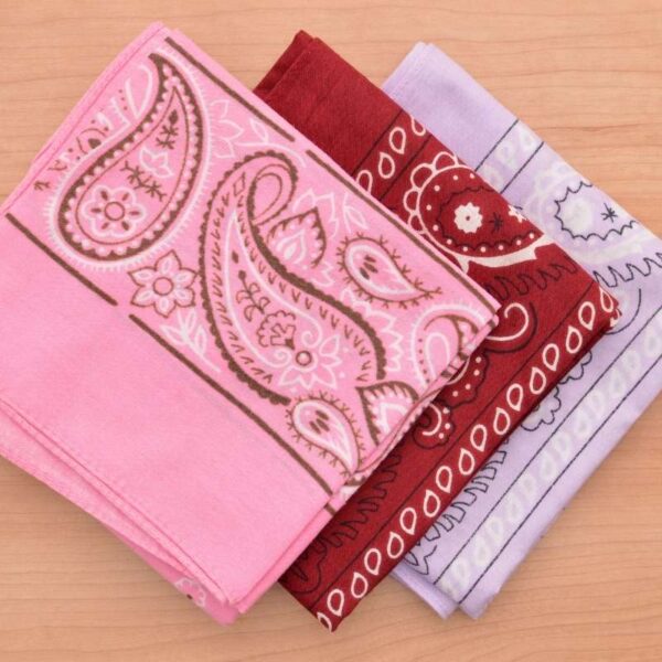 Three different colored custom printed bandanas kept with each other