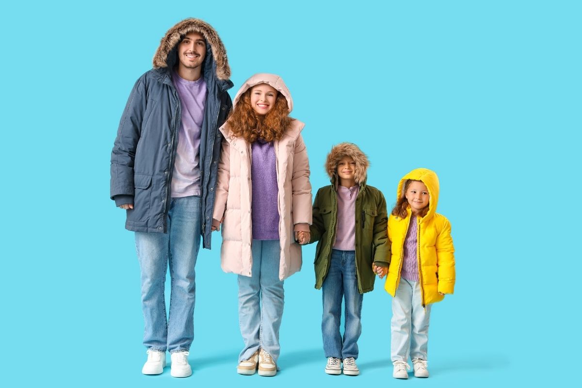A family wearing puffer jackets