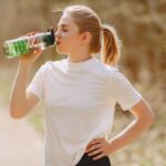 A lady wearing an athletic t-shirt and following unisex athleisure trends