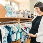 A mother is buying baby boy clothes