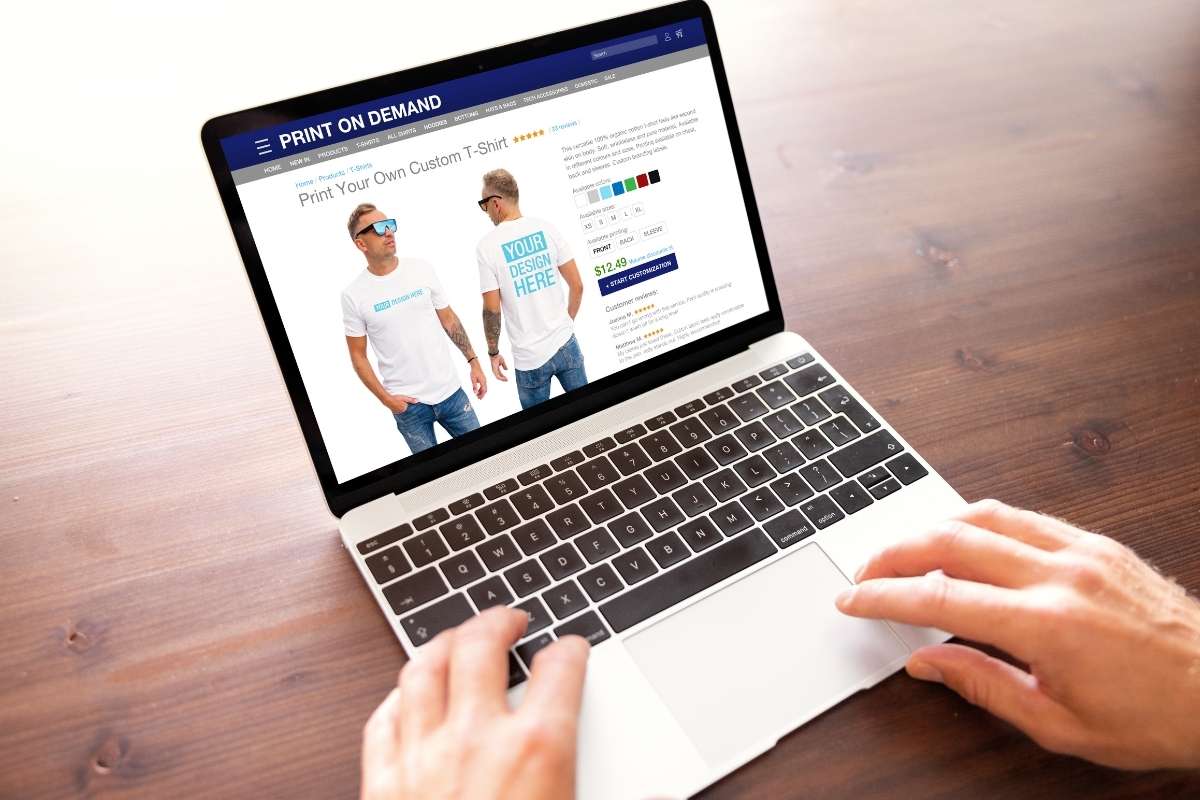 A person is buying custom blank tees from print on demand platform