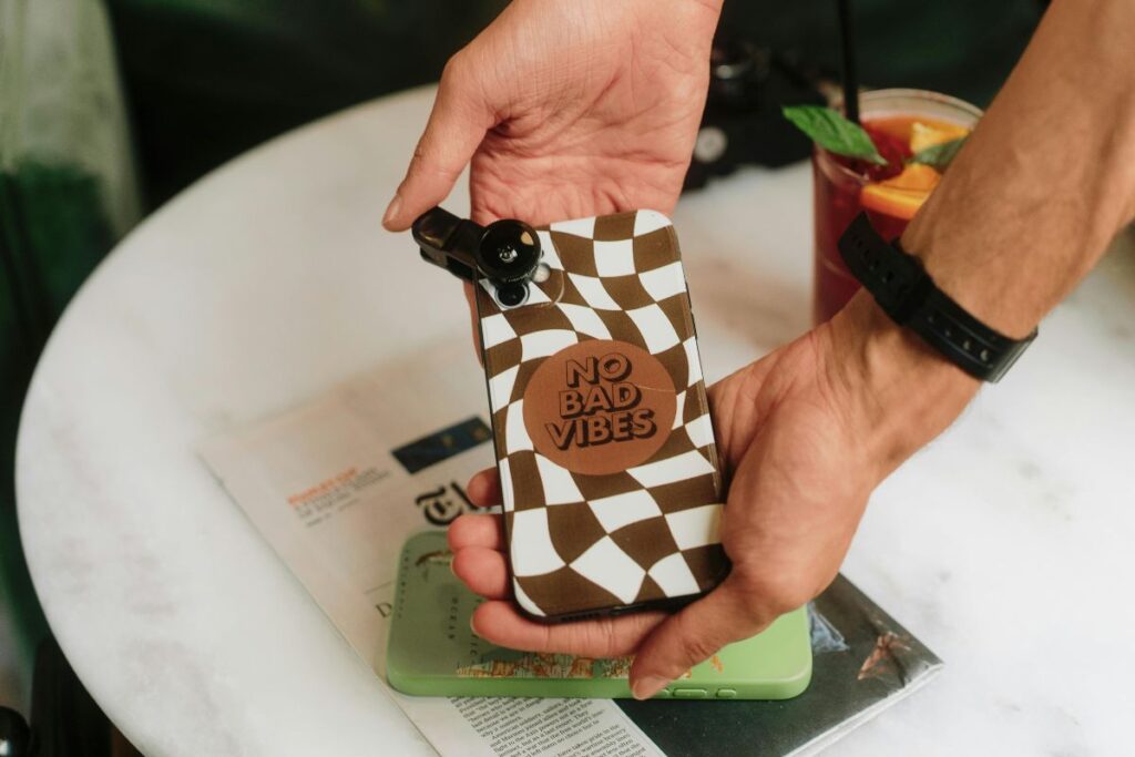 A person showcasing his personalized phone case