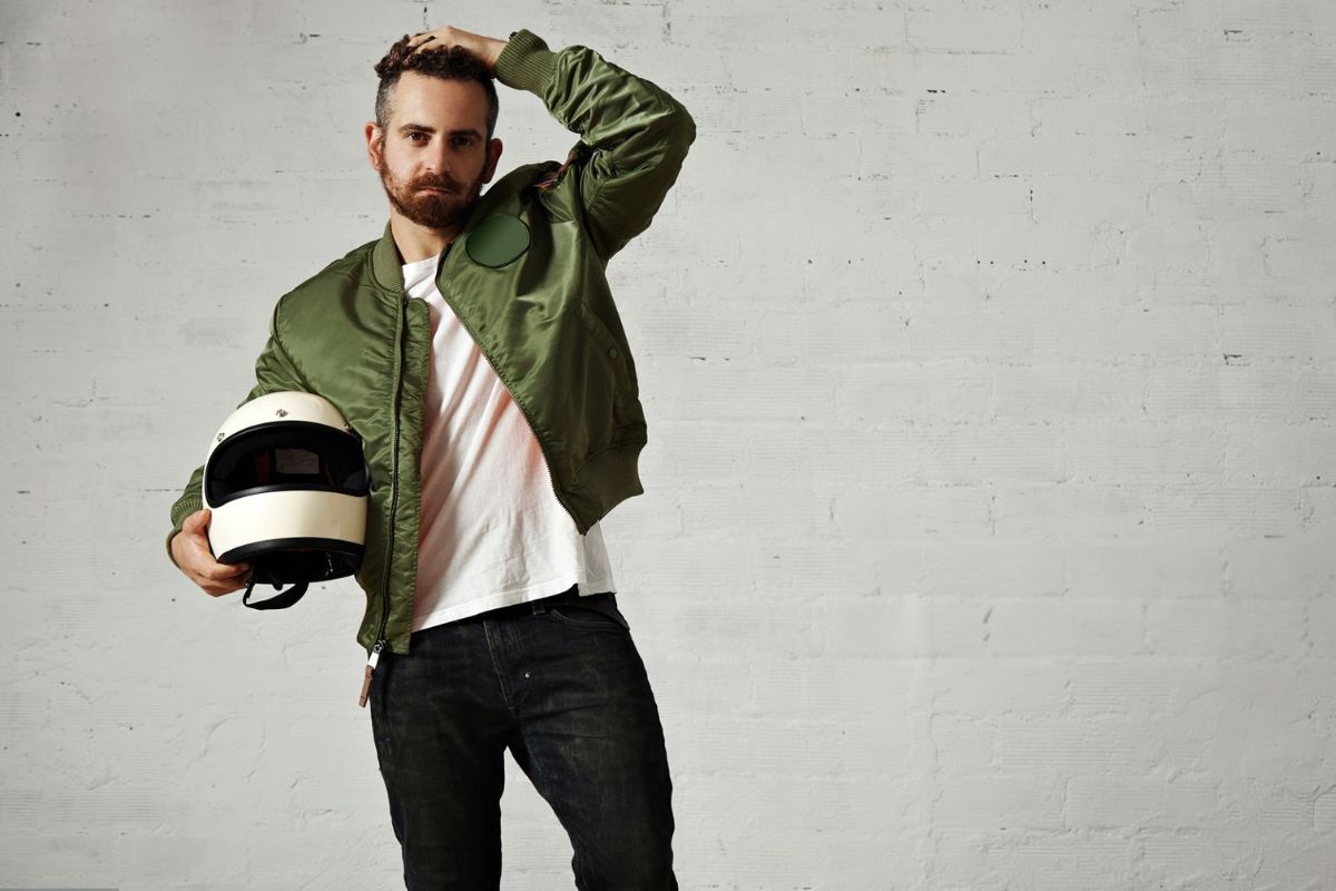 A person styled in a bomber jacket