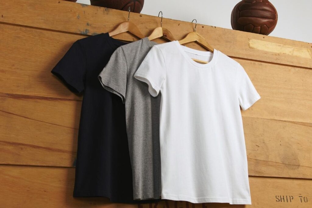 Three blank t-shirts are shown in the image, placed next to each other