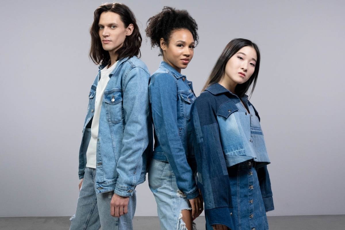 Three people wearing different denim jackets