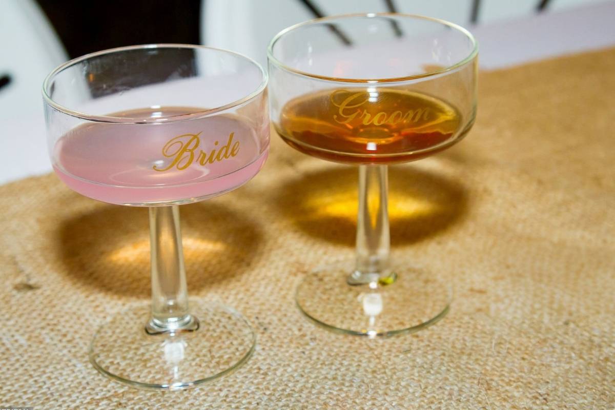 Two personalized wine glass kept with each other