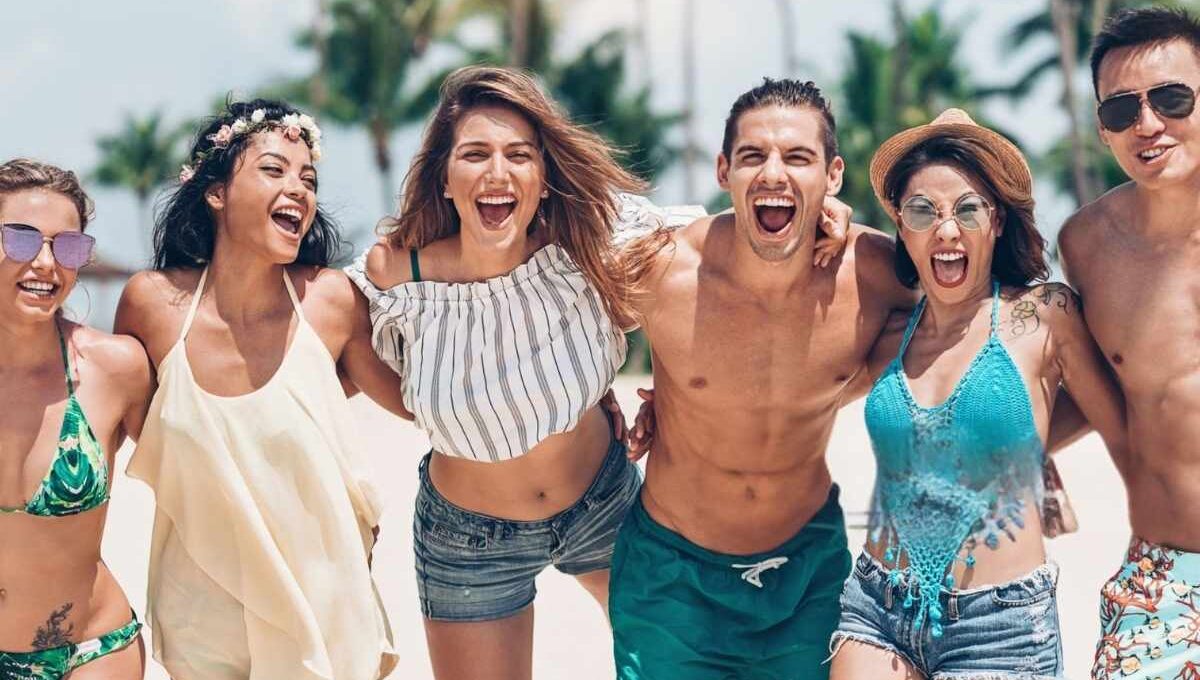 Girls wearing different types of two-piece sets while having fun at the beach