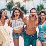 Girls wearing different types of two-piece sets while having fun at the beach