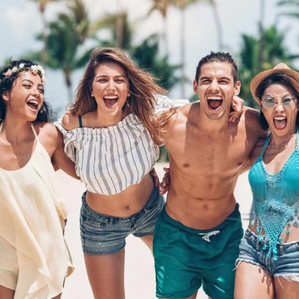 Girls wearing different types of two-piece sets while having fun at the beach