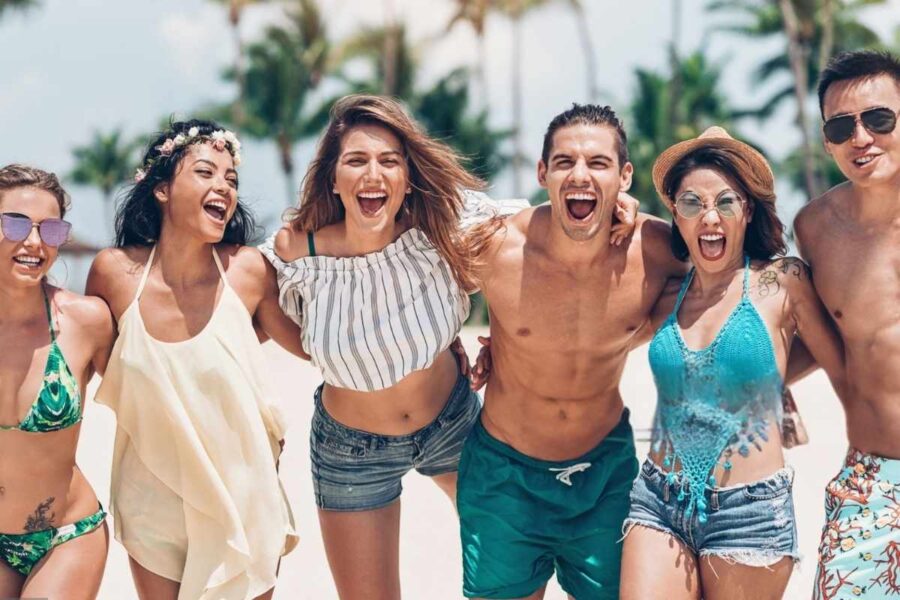 Girls wearing different types of two-piece sets while having fun at the beach